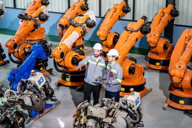 engineer-inspecting-automatic-ai-robot-arm-and-mac-2023-11-27-05-17-29-utc-1.jpg
